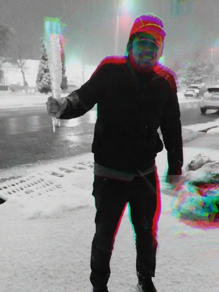 me standing in the snow at night